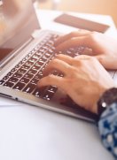 Global Online MBA student checking curriculum